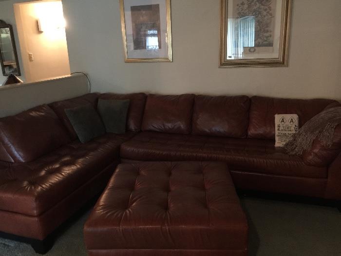 Incredible designer leather couch in a rich supple leather with huge ottoman which opens and has storage ! Client paid over $4,000 for this beauty ! 