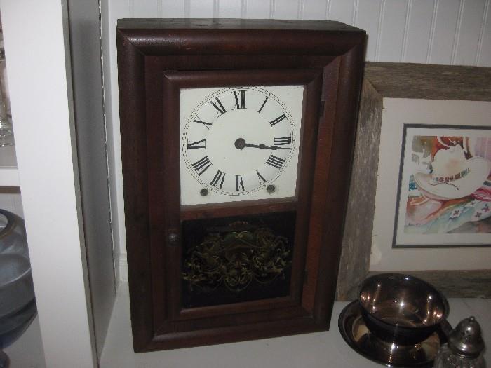 This clock has the original reverse painted glass and works beautifully