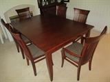 Thomasville dining set with 4 side chairs, 2 captains chairs, table pads and one leaf.  Excellent condition!