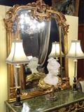 LARGE ROCOCO GILT WOOD MIRROR, CARVED COLUMNS AND FOLIATE DESIGNS