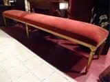 LOUIS XVI STYLE GILT WOOD BENCH, 8 FT LONG, WITH RED VELVET CUSHIONED SEAT