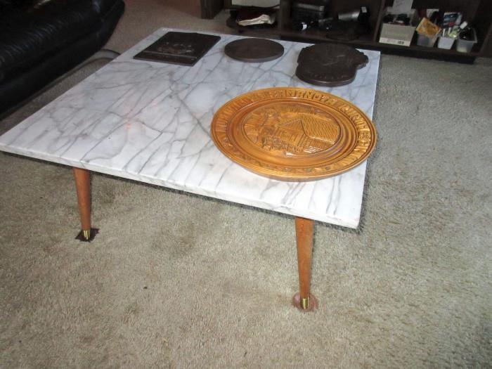 three marble top tables in home.