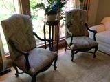 Beautiful pair of arm chairs with detailed wood accents