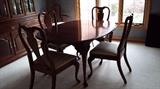 Dining room table with leafs, 6 chairs, and pads for table top