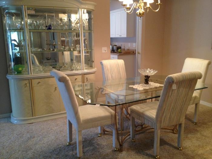 table & 4 chairs with coordinating lighted laminate china cabinet