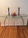Glass top, chrome inspired legs, console table. Excellent condition. 