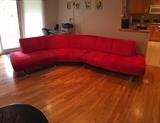 Red sectional sofa with chrome inspired legs.  Non-smoking home. Pet free. Very good condition. 