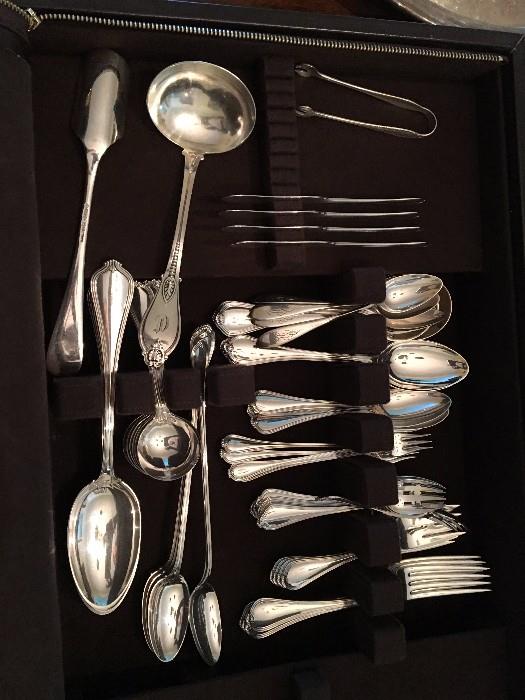 One of two sets of sterling silver flatware.