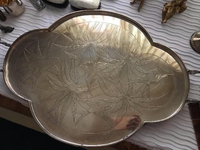 Beautiful quatrefoil silver platter with birds and leaf design.