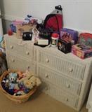 wicker dresser, stuffed animals, lunch boxes