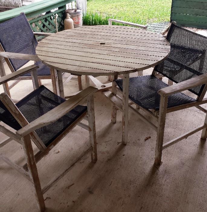patio wooden table with 3 chairs and 1 lounge chair
