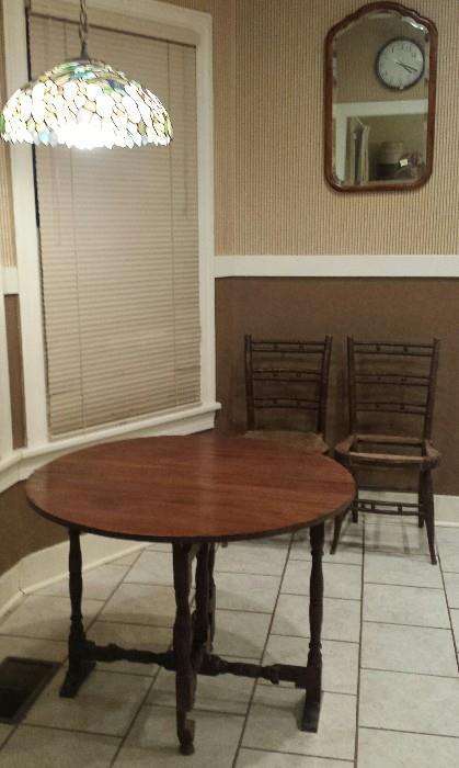 drop leaf table, two Sheraton chairs, mirror