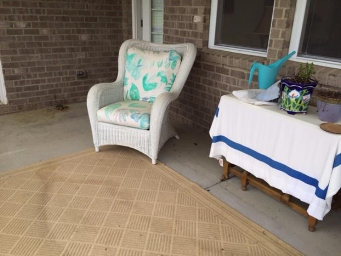 One of Two White Wicker Chairs