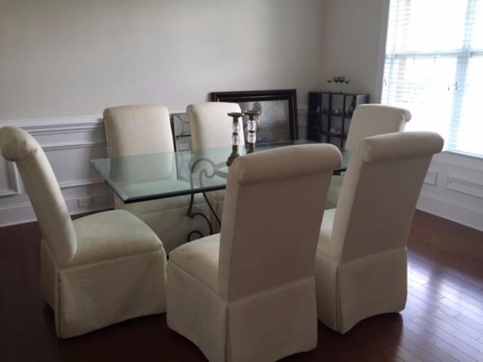 Iron and Glass Top Dining Room Table and 6 White Armless Chairs