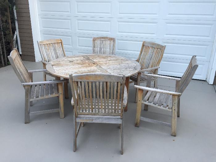 Teak table and 6 armchairs