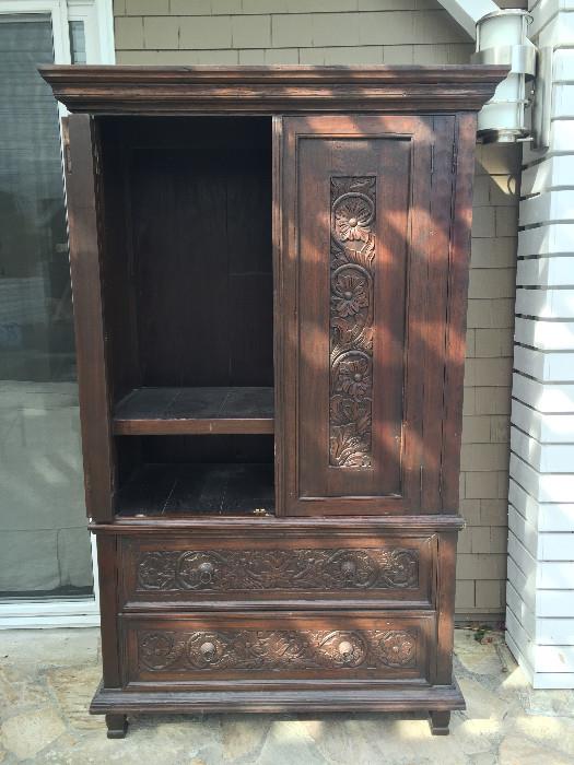 Carved wood Indonesian media armoire