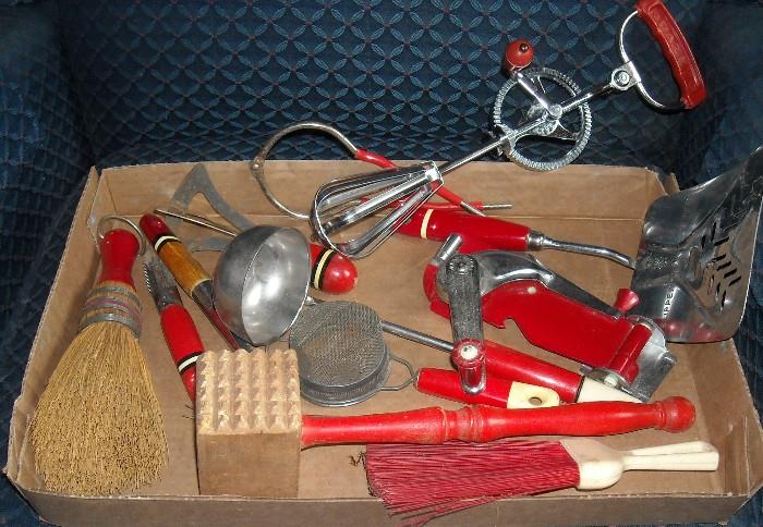Vintage red handled kitchen items.
