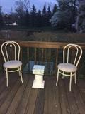 Vintage bistro chairs and pedestal glass side table