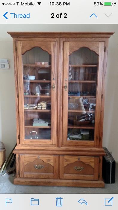 Custom made curio cabinet with hidden gun / rifle cabinet.
