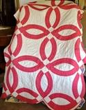 Pink and white double wedding band quilt
