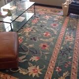 Dhurrie carpet, glass top coffee table
