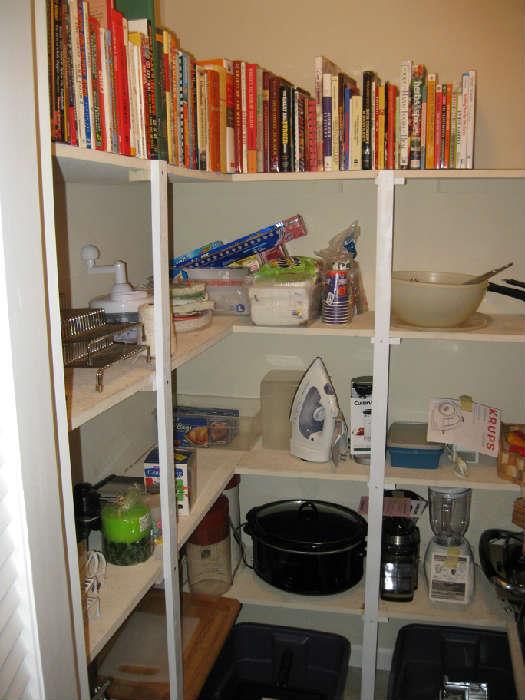 pantry full of cook books and small appliances