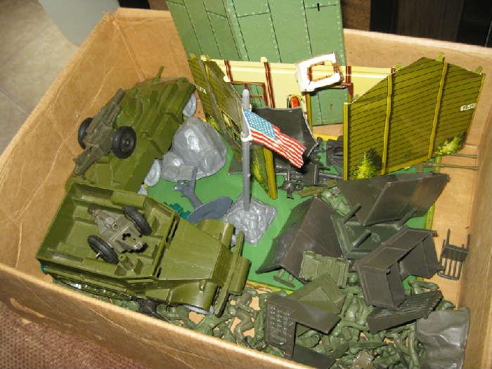 box of army guys and accessories