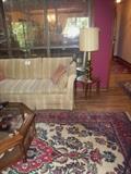 another great large rug, a sleeper sofa & glass top octagonal coffee table