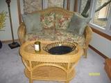 Wicker loveseat and coffee table
