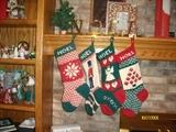 Knitted "Noel" stockings and brass "Noel" stocking holders