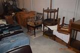 luggage, miscellaneous stools, tables, wood chair.