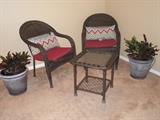 Wicker furniture and live plants. Cushions and pillows sold separately
