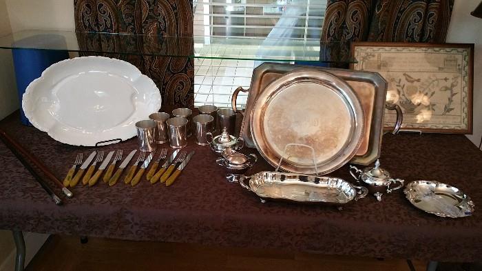 swagger sticks, bakelite utensil set, silver plate platters, haviland platter, mint julep cups, 1830's needlepoint sampler