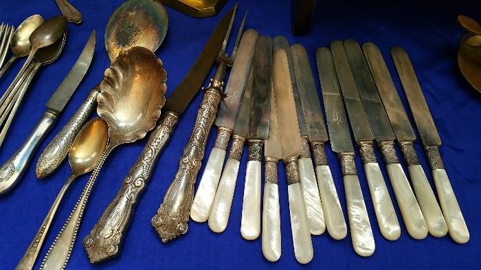 sterling handled and cuffed flatware....mother of pearl handled knives