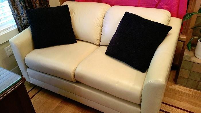 very nice off white leather loveseat - fits with any style!