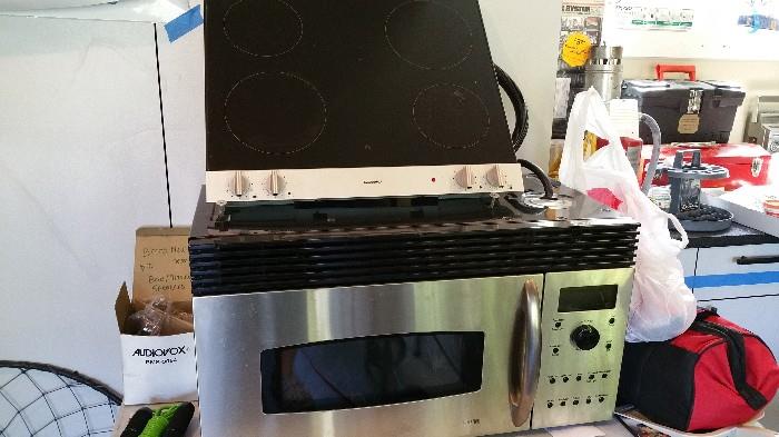 High end glass Gaggenau stove top and GE Profile over stove microware