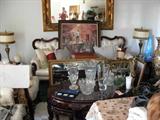 Rosewood sofa and coffeetable with stools underneath. Crystal vases..large mirrors and art