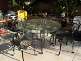 Glasstop patio table with 6 chairs and extra table..not pictured $250 for the set