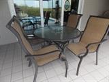 Round glass top patio table & 4 chairs