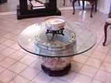 Fish bowl with glass top utilized as coffee table