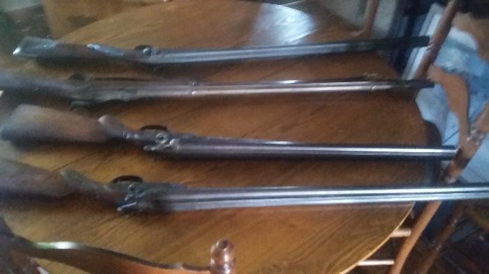 Four antique rifles