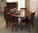 Thomasville gate leg table and rush-seat chairs. Includes leaf and pads.