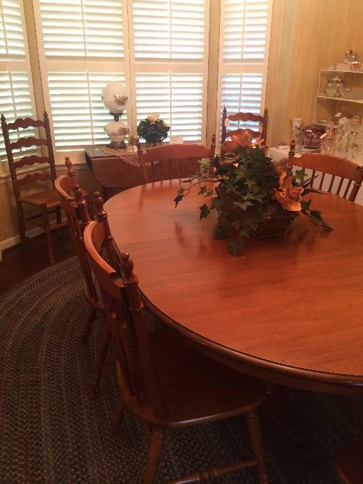 Oval table/6 chairs has matching hutch.