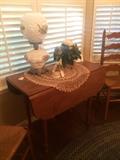 Small drop leaf table; 2 of 3 ladder back chairs; "Gone With the Wind" Lamp