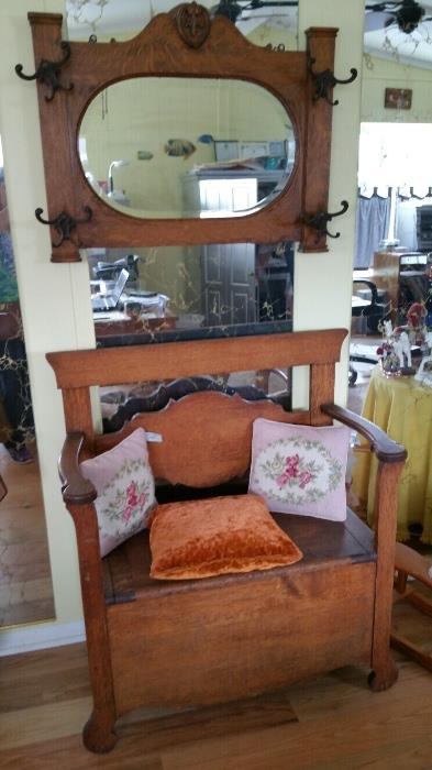 Very nice antique oak storage hall bench and antique oak mirrored hat rack.