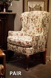 Pair of upholstered wingback chairs with fun floral fabric