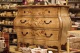 Three drawer bombe chest with floral details
