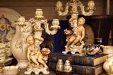 Antique porcelain candlesticks with cherubs 