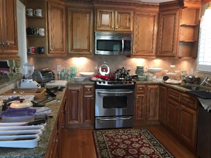 Many useful kitchen items including Revere Ware pots and pan, toaster oven, blender, coffee machines and more
