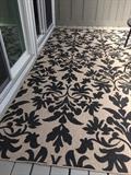 Indoor/outdoor 8x10 rug, it's in great shape since it's been under a covered roof